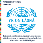 YK on läsnä teksti ja YK:n logo