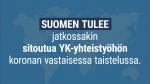 Teksti "Suomen tulee jatkossakin sitoutua YK-yhteistyöhön koronan vastaisessa taistelussa" taustana himmeä kuva maailmankartasta